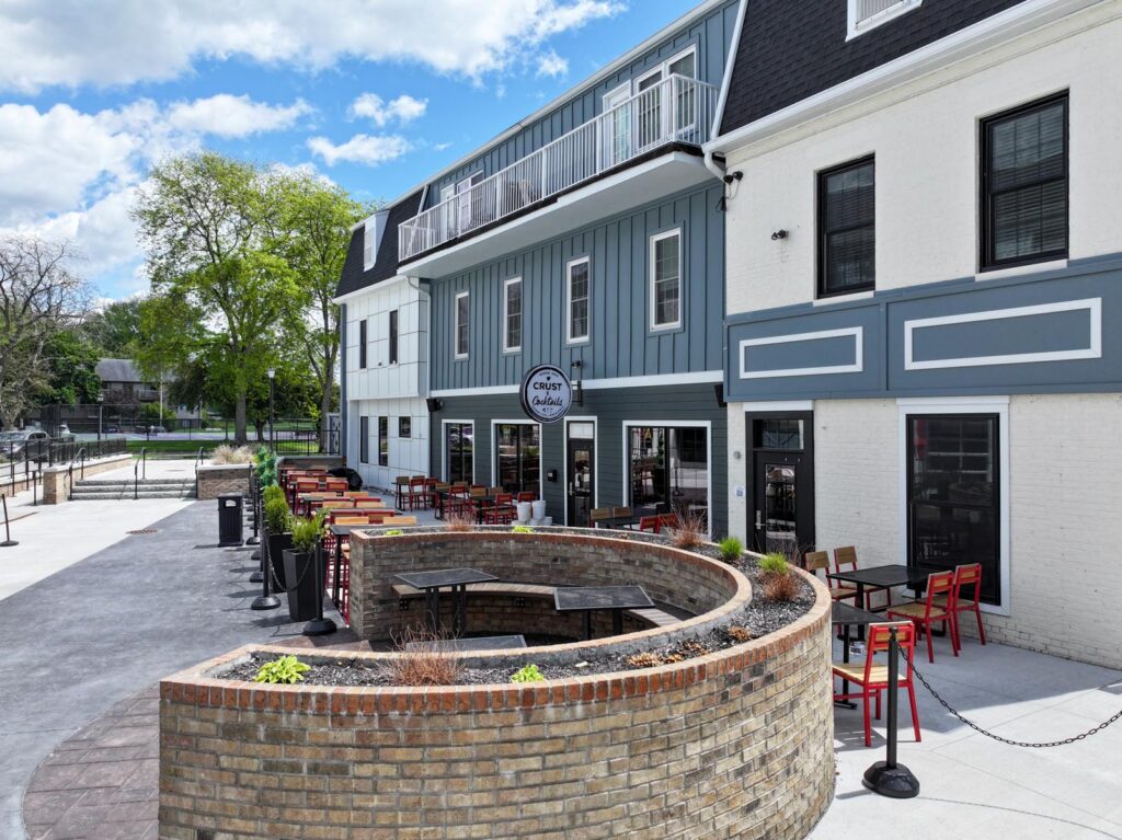 Exterior of a restaurant with tables outside