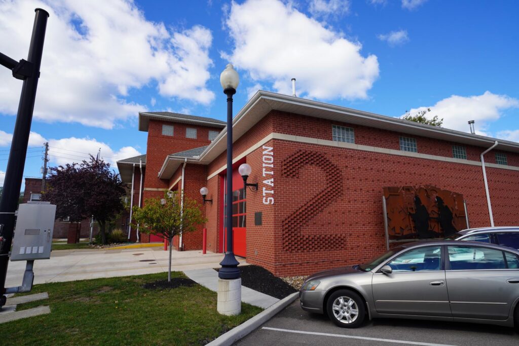 Exterior of a fire station with the number two shown in the bricks
