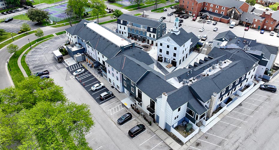 Aerial view of large white buildings in a campus