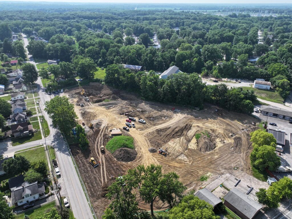 Aerial view of a construction site with dirt paths