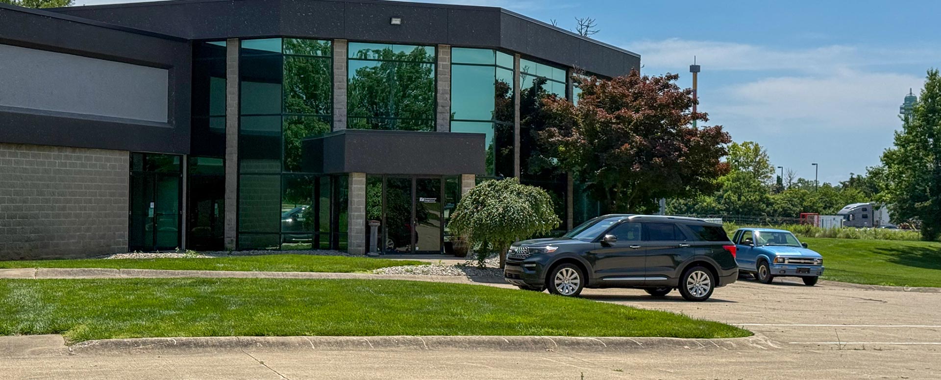 Exterior view of the Mason office with large glass reflective windows