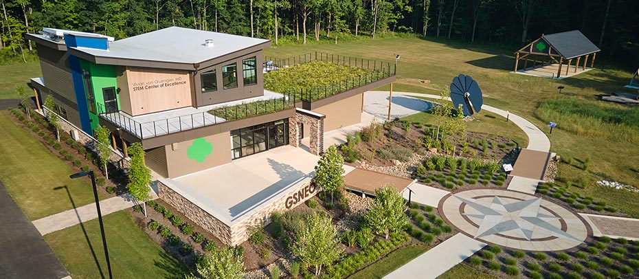 Girl Scout building on a well manicured campus with a pavilion, living roof, and walkways