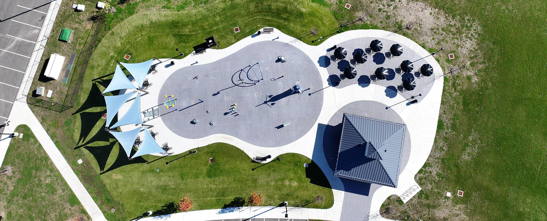 Aerial view of a modern playground with shade on both sides