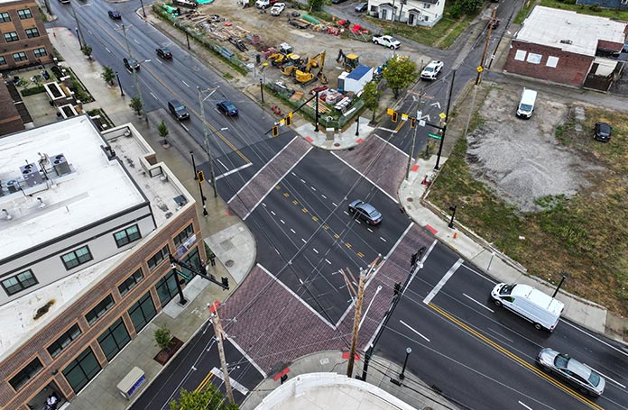 Aerial view of a busy intersection with walkways on all sides