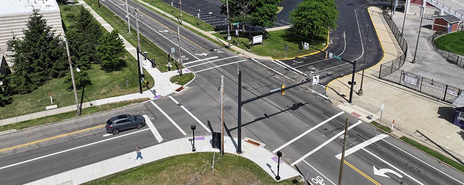 Overhead view of an intersection with one road winding